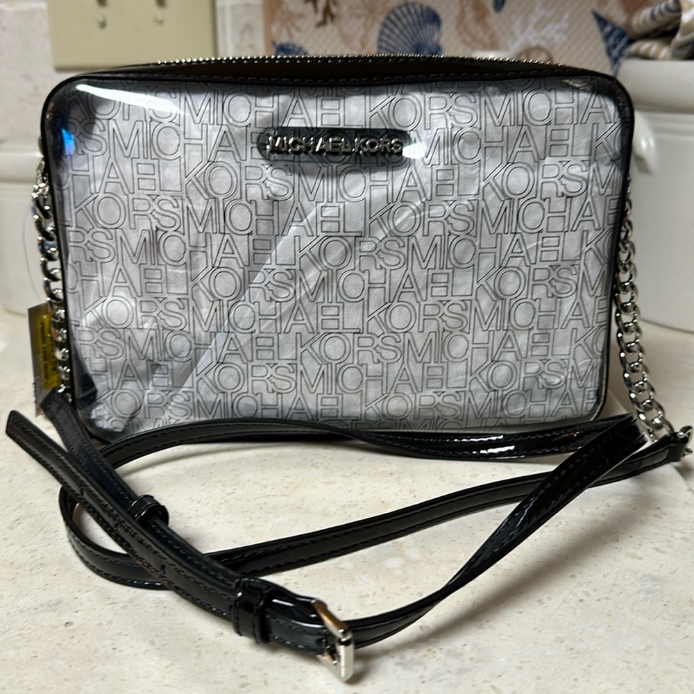 Michael Kors, Black patent trim & strap with clear front & back panels.